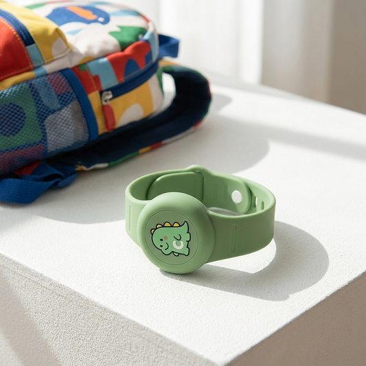 Kids GPS tracker wristband on white surface